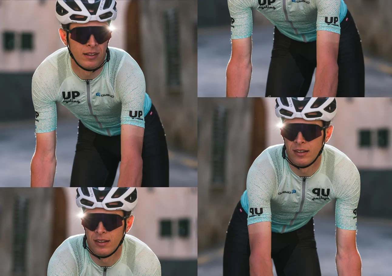 Een fietser in een lichtblauw gemusterd tricot met het logo 'UP cycling' en de merknaam 'owayo' op de borst, die op een fiets rijdt.